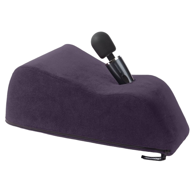 Wanda Toy and Mount by Liberator shown in purple microfiber. Angled pillow with wand-style vibrator inserted for hands-free use.